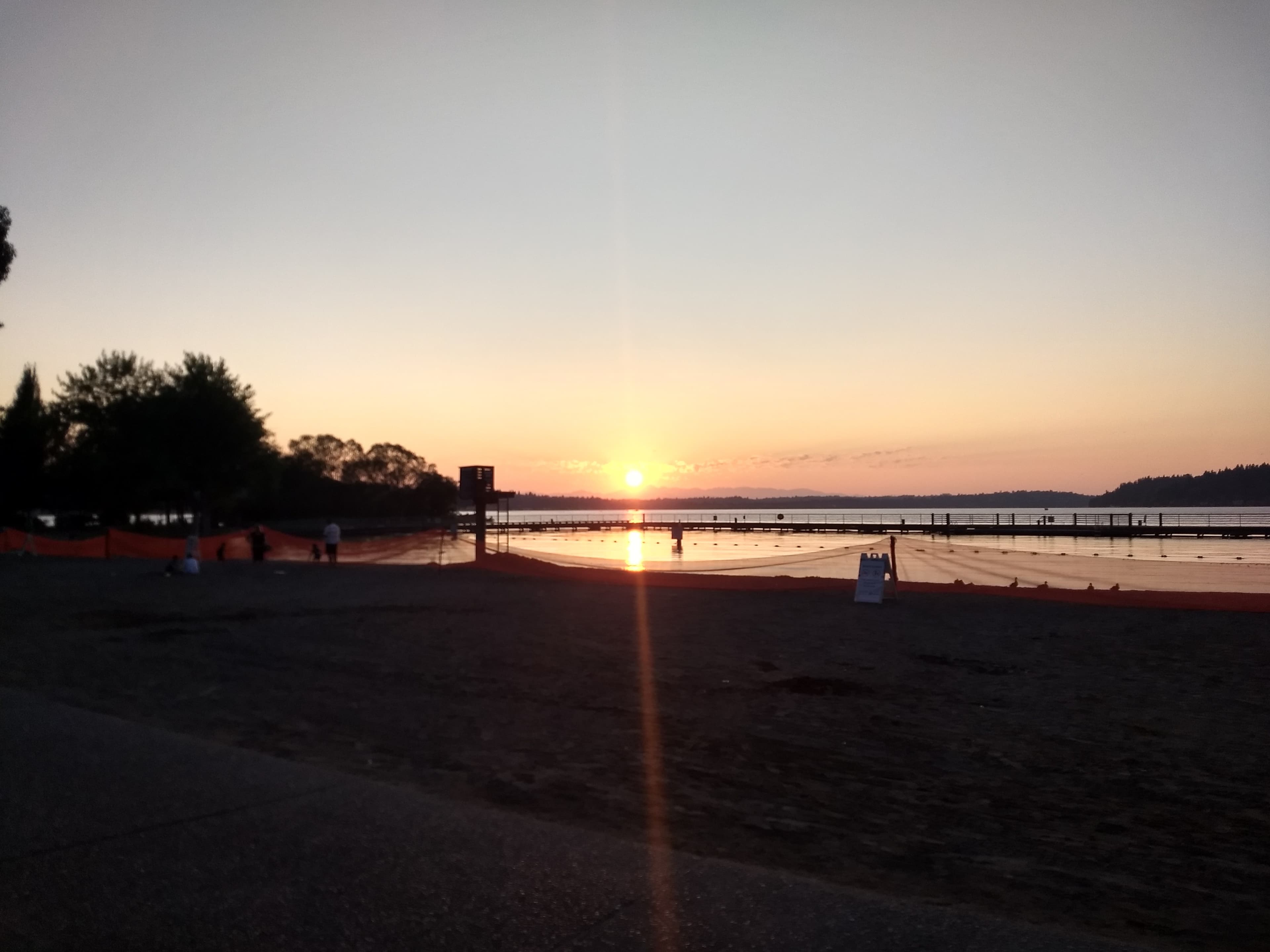 August sunset over Lake Washington at Gene Coulon Memorial Beach Park